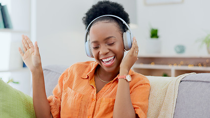Image showing Dance, headphones or happy black woman on sofa for music streaming, mental health or wellness. Energy, couch or fun African person listening to audio technology and singing a hip hop song to relax