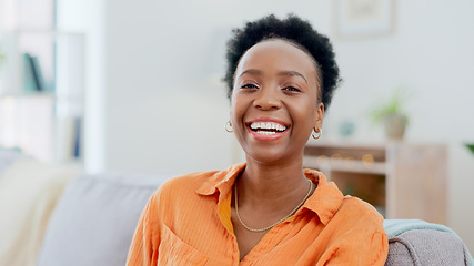 Image showing Portrait, funny and a black woman laughing on a sofa in the living room of her home to relax on the weekend. Face, smile and comedy with a happy young person in her apartment to joke for humor