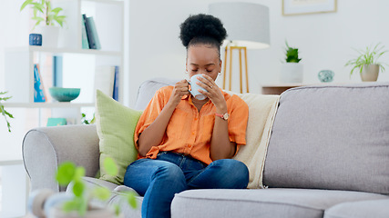 Image showing Black woman, home and drinking coffee on sofa, relaxing and smiling for self care, living room and break. Me time, comfort and quality time in house, sofa and day off for rest, laughing and happiness