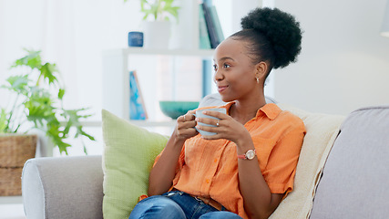 Image showing Black woman, smiling and sofa with hot beverage, relaxing and house for self care, lounge and break. Me time, comfort and quality time in home, lounge and day off for resting, laughing and happiness