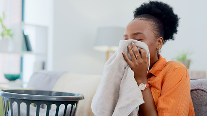 Image showing Clean, smell and black woman with laundry in home or basket with clothes, linen or maid spring cleaning in apartment. Fresh, washing and clothing with detergent or cleaner aroma on fabric in house