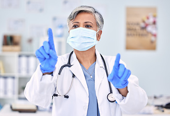 Image showing Doctor, invisible screen and woman press key on technology for healthcare, wellness and telehealth. Hands, click virtual button and mature medical professional in face mask for innovation at hospital