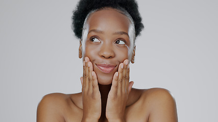 Image showing Woman, hands and smile for skincare with cosmetic, natural and makeup for beauty, self care and facial. Black model, young and happy with dermatology for beautiful aesthetic in grey studio mockup