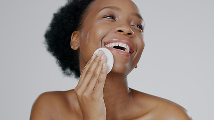 Image showing Face, model and hands for beauty with cleanser, cotton sponge and cosmetic in gray background studio. Black woman, healthy skin and dermatology with self care, facial and skincare aesthetic in mockup