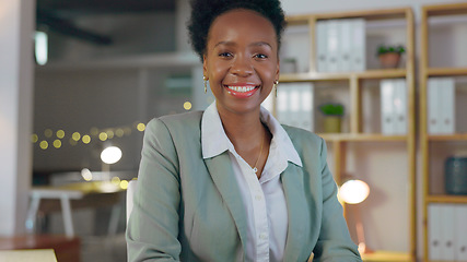 Image showing Portrait, smile and business black woman manager in an office at night for corporate or professional work. Management, leadership and evening with a happy young CEO or boss in a suit at the workplace