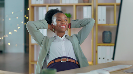 Image showing Happy black woman, relax and break at office from computer, done or finished with tasks. African female person or employee smile with hands behind head in stretching, rest or competition at workplace