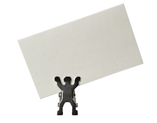 Image showing Figurine holding a piece of blank business card