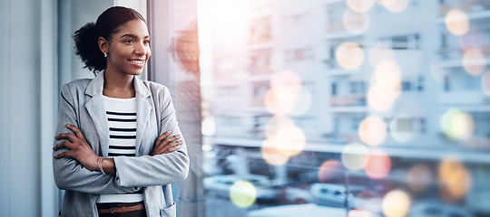 Image showing Black woman, office and arms crossed with confidence, leadership and city buildings in bokeh. Smiling, work and career as professional, corporate and hr specialist in company, happy and workplace