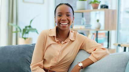 Image showing Smile, black woman and portrait on the sofa in house as homeowner, real estate investor or mortgage loan buyer. Young, happy or an African person on living room couch or apartment property furniture