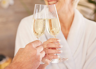 Image showing Senior couple, smile and champagne in spa for relaxing, toast and celebrate for retirement and wellness. Elderly people, peaceful and zen in luxury hotel, hospitality and care by facial or massage