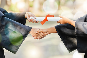 Image showing Graduation diploma, university and people shaking hands for learning success, education development or graduate scroll. College certificate, school ceremony handshake and closeup students achievement