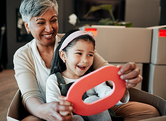 Image showing Senior woman, kid and moving boxes with smile, playing and happy with grandmother, grandchild or new property. Family home, excited and enjoying at house, driving and bonding for memories, fun or joy