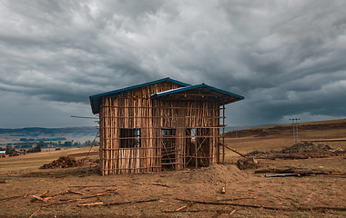 Image showing Ethiopian farmer building from wood, Amhara Region, Ethiopia