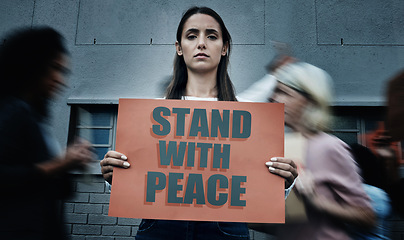 Image showing Portrait, city and a woman with a sign at a protest for justice, social change or peace. Law, support and a serious person with a banner or board for government problem, human rights or a rally