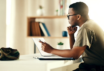 Image showing Black man, laptop and reading military information, planning or army surveillance indoor at base. Computer, soldier and concentration on web research at data center for cyber security and protection