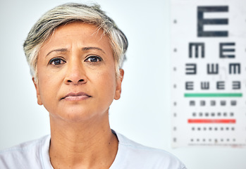 Image showing Senior woman, patient and serious portrait and vision test at healthcare, hospital and clinic. Medical exam, elderly female person and face with appointment and ready for prescription for eye care