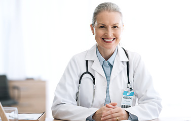 Image showing Mature woman doctor, smile and portrait in office for healthcare, wellness and insurance. Happy medical professional, confident and expert therapist or surgeon to trust and support or about us