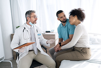 Image showing Hospital, doctor and couple with sad news for medical service, comfort and empathy for diagnosis. Healthcare, consulting and person with man and woman holding hands for support, wellness or results