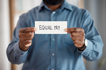 Image showing Hands, paper sign and equal pay for person in office with opinion, vote and activism with promotion. Business, board or banner for gender equality, worker and human rights for salary in workplace