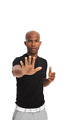 Image showing Studio portrait, man and stop gesture with hand for warning, order and threat on white background. Black model, authority pose and body language with attention, protection and protest to decline