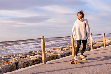 Image showing Girl riding a skateboard 