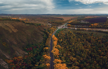 Image showing Aerial view of road in beautiful autumn altai forest