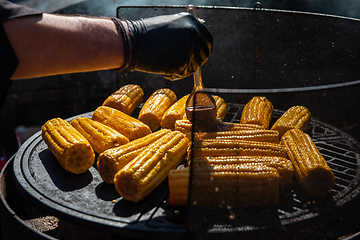 Image showing A professional cook prepares corn