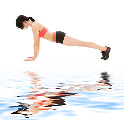 Image showing woman practicing four-limbed staff pose