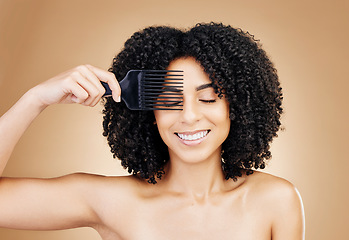 Image showing Hair, comb and happy woman with afro as style isolated in a studio brown background for wellness and skincare. Texture, natural and young person with cosmetic aesthetic in Brazil hairdresser