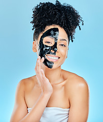 Image showing Skincare, charcoal face mask and portrait of woman for facial treatment, anti aging and wellness. Beauty, studio and happy person with products for health, cosmetics or grooming on blue background