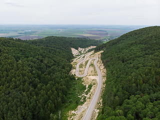 Image showing Aerial top vew of winding road in the mountains