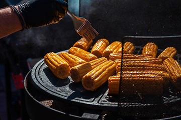 Image showing A professional cook prepares corn