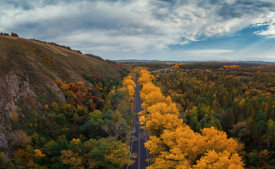 Image showing Aerial view of road in beautiful autumn Altai forest