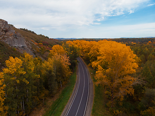 Image showing Aerial view of road in beautiful autumn Altai forest