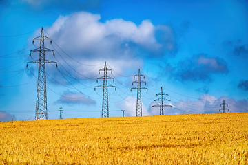 Image showing High voltage power lines against a blue sky