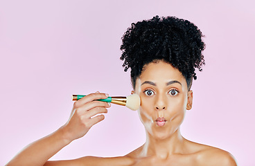 Image showing Woman, brush for makeup and kiss, face and beauty with foundation isolated on pink background. Model with surprise, cosmetic tools and portrait, pouty lips and natural with powder in a studio