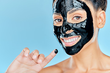 Image showing Beauty, charcoal face mask and portrait of woman for facial treatment, anti aging detox and wellness. Skincare, studio and person with products for health, cosmetics or grooming on blue background