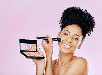 Image showing Makeup brush, palette and studio portrait of happy woman with tools, beauty product or cosmetics powder choice. Mirror, facial cosmetology treatment and face of dermatology person on pink background