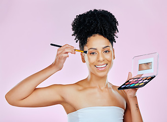 Image showing Makeup palette, portrait and woman smile for brush, beauty routine and apply face design powder, foundation or product. Creative, self care illness and aesthetic cosmetics artist on pink background