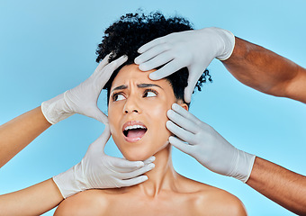 Image showing Skincare, hands with gloves and woman scared in studio for facial plastic surgery consultation. Model with stress, fear and anxiety for beauty, dermatology or collagen therapy on blue background.