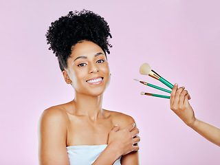 Image showing Makeup brush, smile and studio portrait of woman with tools choice for skincare glow, routine treatment or wellness self care. Beauty spa cosmetics, happiness and model makeover on pink background