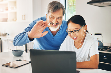 Image showing Laptop, video call and senior couple in the kitchen for online communication in modern home. Happy, smile and elderly Asian man and woman wave for greeting on virtual conversation with computer.