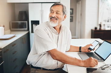 Image showing Laptop, research and senior man in the kitchen networking on social media, website or the internet. Happy, technology and elderly Asian male person in retirement browsing on computer in modern home.
