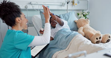 Image showing Happy woman, doctor and high five with child patient for success, teamwork or good job on hospital bed. Friendly female person or medical nurse touching hands of little boy smile in support at clinic