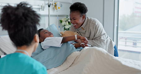 Image showing Nurse, mother and son playing in a hospital together during recovery with professional care. Medicine, funny family and children with people in a healthcare clinic for rehabilitation or treatment