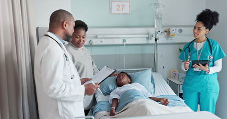 Image showing Man, doctor and child patient in consultation, exam or checkup appointment on hospital bed. Male person, surgeon or medical team with little boy or mother in healthcare diagnosis or results at clinic