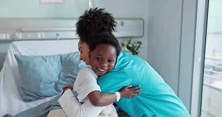 Image showing Happy woman, doctor and child hug for teddy bear, healthcare or support on hospital bed. Female person, nurse or medical assistant hugging little boy smile with soft toy at clinic for checkup or care