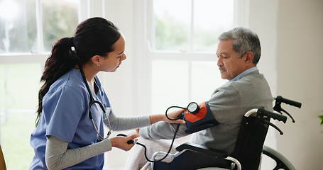 Image showing Blood pressure, nurse and senior man in wheelchair for medical care, wellness and service. Healthcare, retirement home and caregiver with heart rate machine on person with disability for cardiology