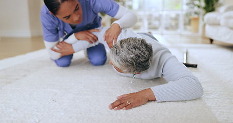 Image showing Fall, accident or emergency with a nurse and old woman on the floor of an assisted living house or apartment. Healthcare, help or injury with a senior patient in her retirement home with a caregiver
