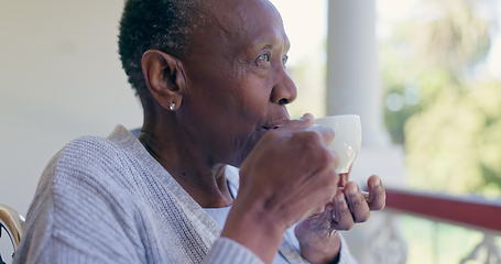 Image showing Senior woman, thinking and relax with coffee on a front porch with nostalgia at a nursing home. Assisted living, tea and elderly African female enjoy a calm drink, peace or fresh air alone outdoors